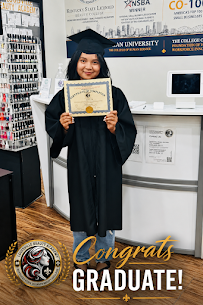 Louisville Beauty Academy 2026 graduate holding certificate in front of national award wall