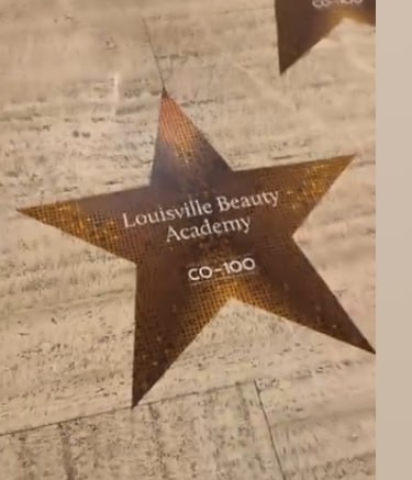 CO-100 event floor star marker showing Louisville Beauty Academy