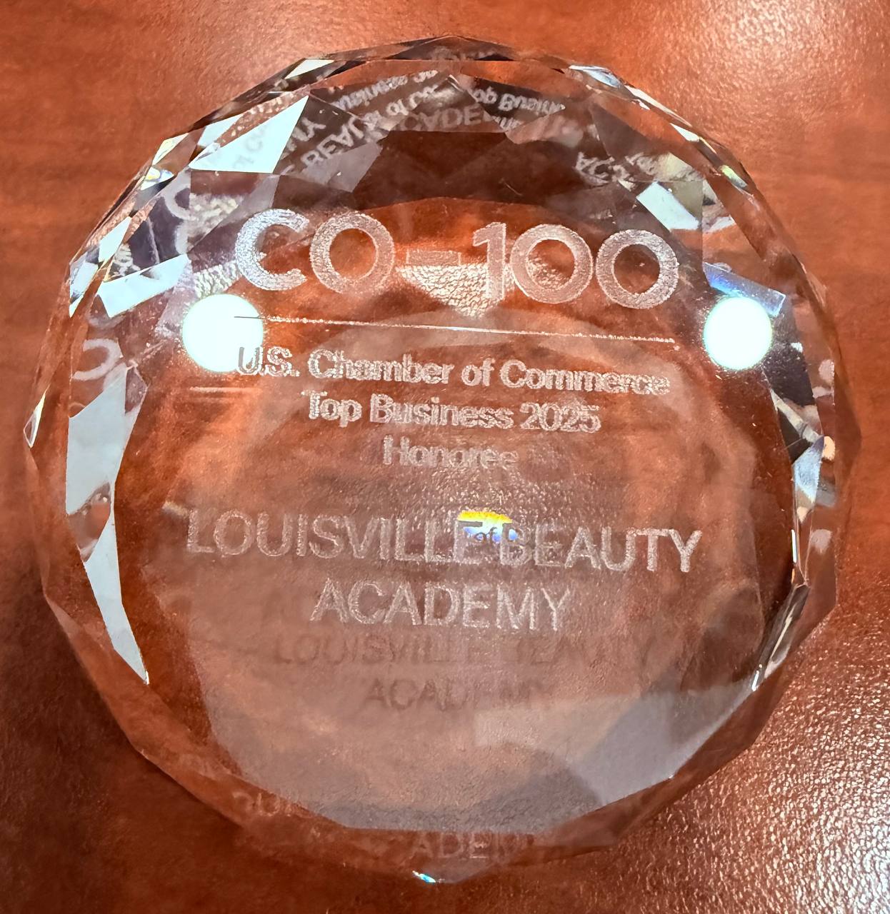 U.S. Chamber CO-100 Top Business 2025 Honoree trophy for Louisville Beauty Academy